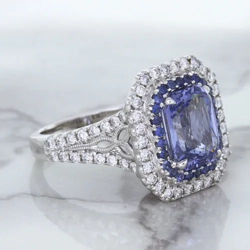 4.33ct Radiant Cut Blue Sapphire Ring with Sapphire and Diamond Halos in 18K White Gold