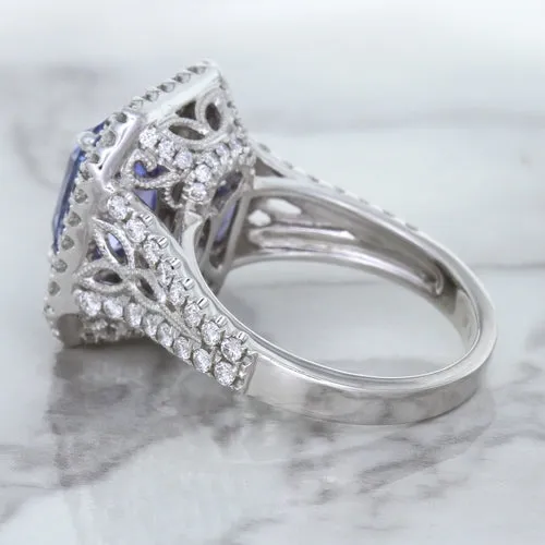 4.33ct Radiant Cut Blue Sapphire Ring with Sapphire and Diamond Halos in 18K White Gold