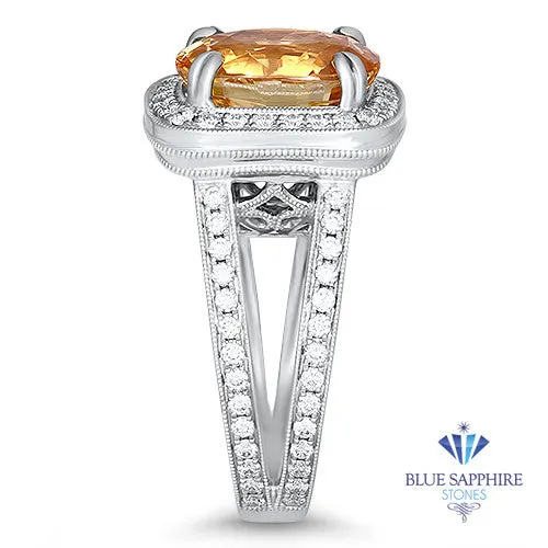 6.58ct Oval Orangey Peach Sapphire with diamond halo in 18K White Gold