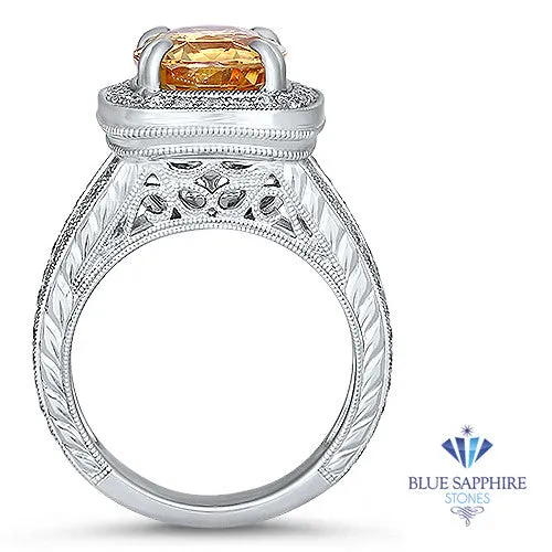 6.58ct Oval Orangey Peach Sapphire with diamond halo in 18K White Gold